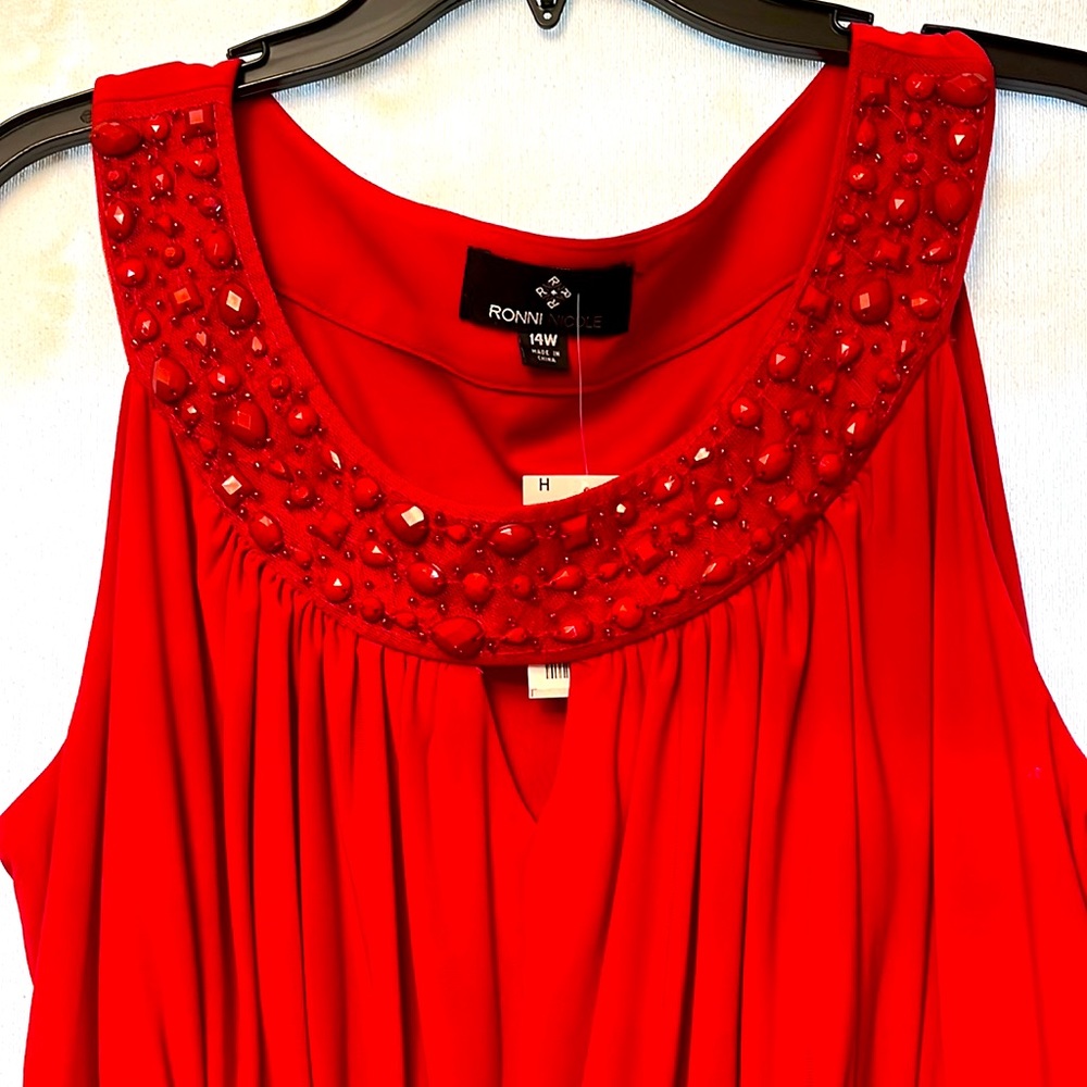 Sleeveless evening wear.  Gorgeous jeweled neckline.